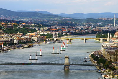 High angle view of river by town against sky