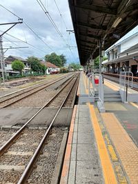 Railroad station platform against sky