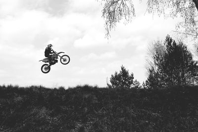 Man riding motorcycle in mid-air