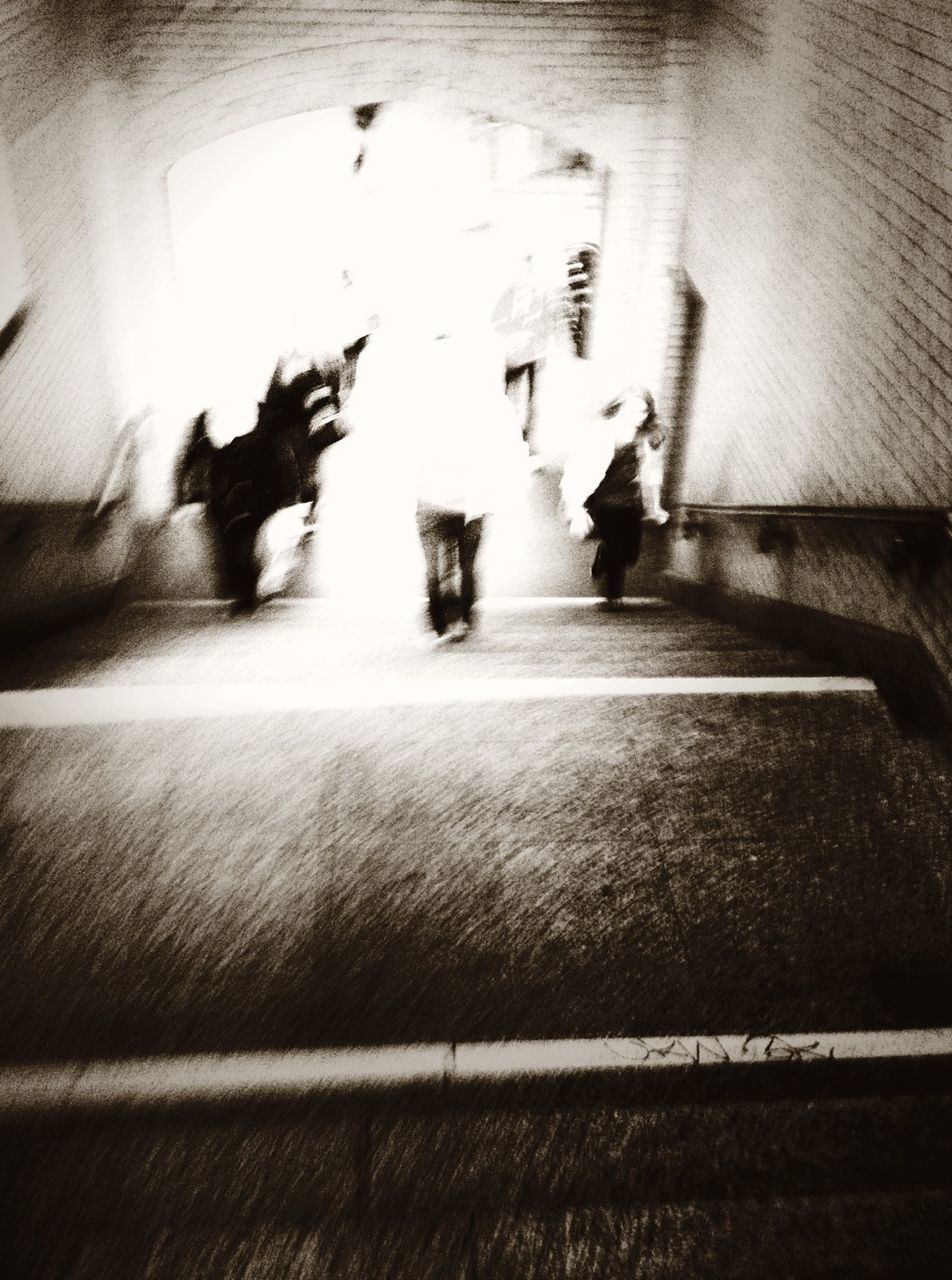 indoors, lifestyles, men, leisure activity, person, togetherness, flooring, full length, walking, bonding, shadow, wall - building feature, illuminated, boys, high angle view, silhouette