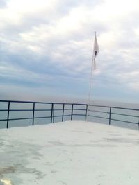 Lifeguard hut on beach against sky