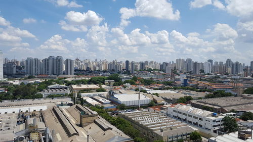 Cityscape against cloudy sky