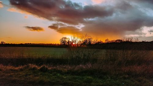 Scenic view of dramatic sky during sunset