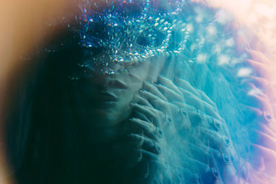 Close-up of woman swimming in pool