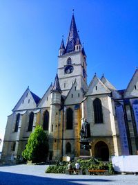 Low angle view of traditional building against clear blue sky