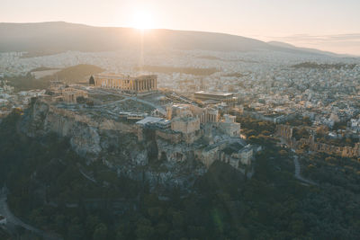 High angle view of city at sunset