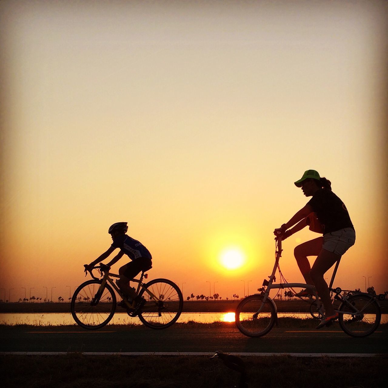 bicycle, transportation, land vehicle, mode of transport, riding, cycling, sunset, lifestyles, men, leisure activity, motorcycle, silhouette, stationary, full length, parked, on the move, copy space, travel