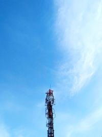 Low angle view of communications tower against sky