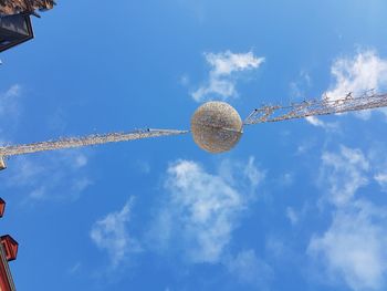 Low angle view of tree against blue sky