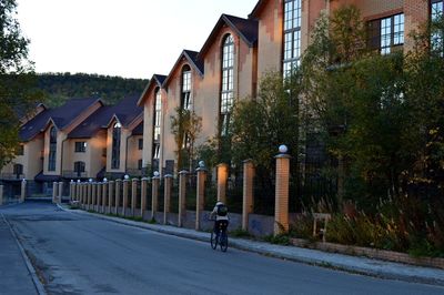 Road by building against sky