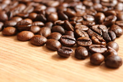 Close-up of coffee beans on table