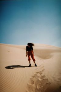 Full length of woman standing on beach