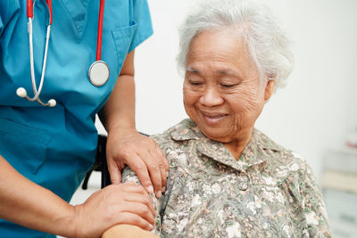 Midsection of woman holding hands