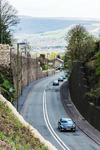 High angle view of cars on street against sky