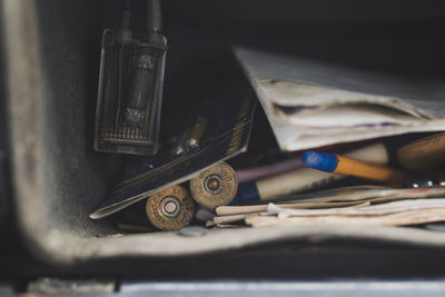 Close-up of old equipment on table