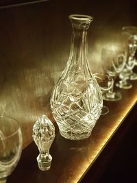 Close-up of wine glasses on table