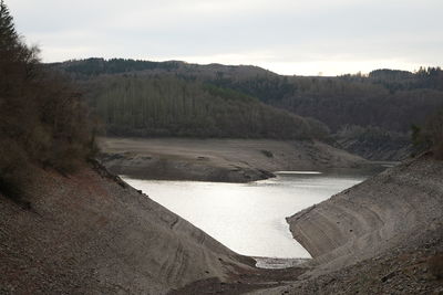 High angle view of river amidst landscape against sky