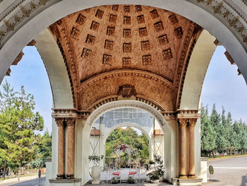 Archway of historic building against sky