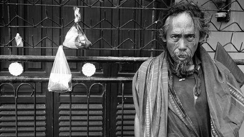 Portrait of man standing outdoors