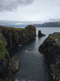 Scenic view of sea against cloudy sky