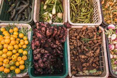 High angle view of vegetables and fruits for sale at market stall
