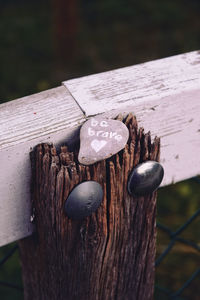 Close-up of wooden post on fence