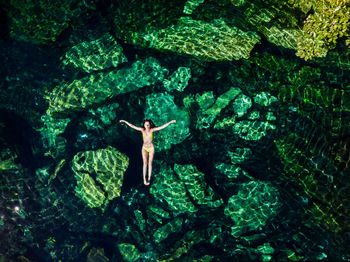 Directly above shot of woman swimming in sea