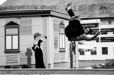 Woman jumping in city