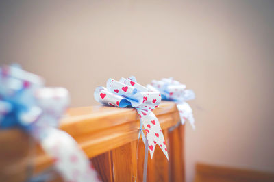 Tied bows on wooden railing