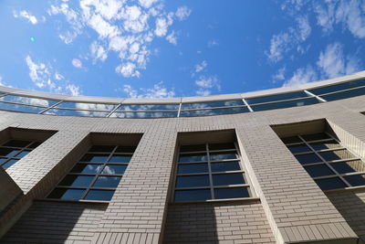 Low angle view of building against blue sky