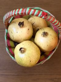 High angle view of apples in basket on table