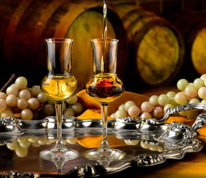 Close-up of wine glasses on table