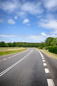 Surface level of empty road against sky