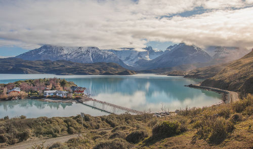 Scenic view of lake and mountains against sky