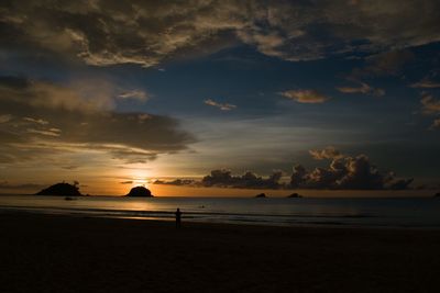 Scenic view of beach against sky during sunset