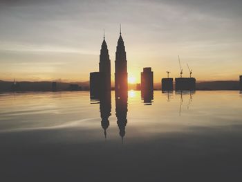 Silhouette of building at sunset