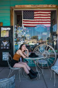 Woman sitting at outdoor cafe