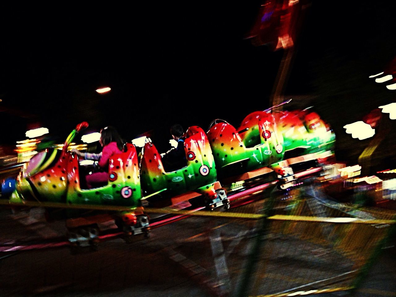 multi colored, transportation, night, illuminated, mode of transport, variation, in a row, colorful, high angle view, no people, large group of objects, land vehicle, indoors, blue, arrangement, art and craft, street, blurred motion, copy space