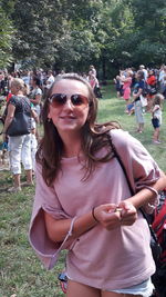 Young woman wearing sunglasses in park