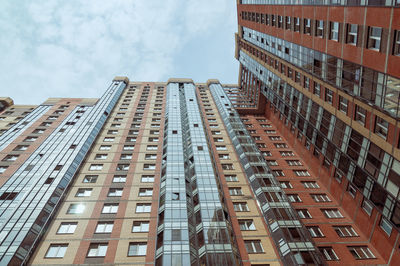 Low angle view of modern buildings against sky