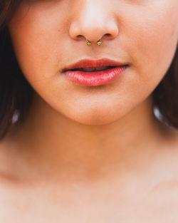 Close-up of a  young woman with septum piercing