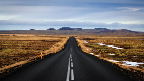 Road amidst landscape against sky