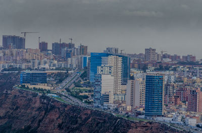 High angle view of orans city,  buildings in against sky