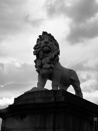 Low angle view of statue against cloudy sky