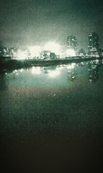 Reflection of trees in water at night