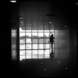 Person standing in front of building