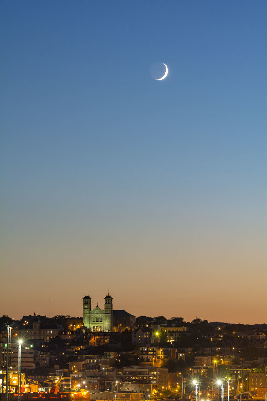 moon, architecture, building exterior, built structure, city, night, illuminated, cityscape, sky, no people, outdoors, sunset, travel destinations, clear sky, nature, beauty in nature, urban skyline, tree, astronomy