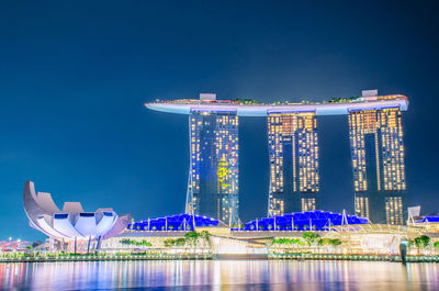 Illuminated modern building in city at night