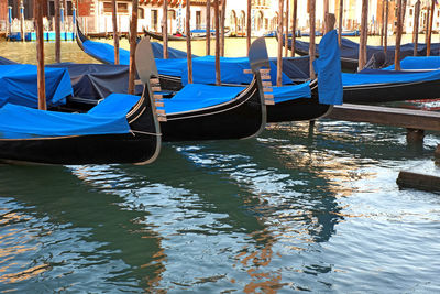 Boats moored in canal