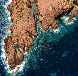 High angle view of rock formation in sea